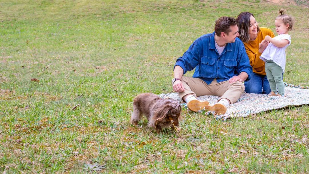 Family playing in yard together.