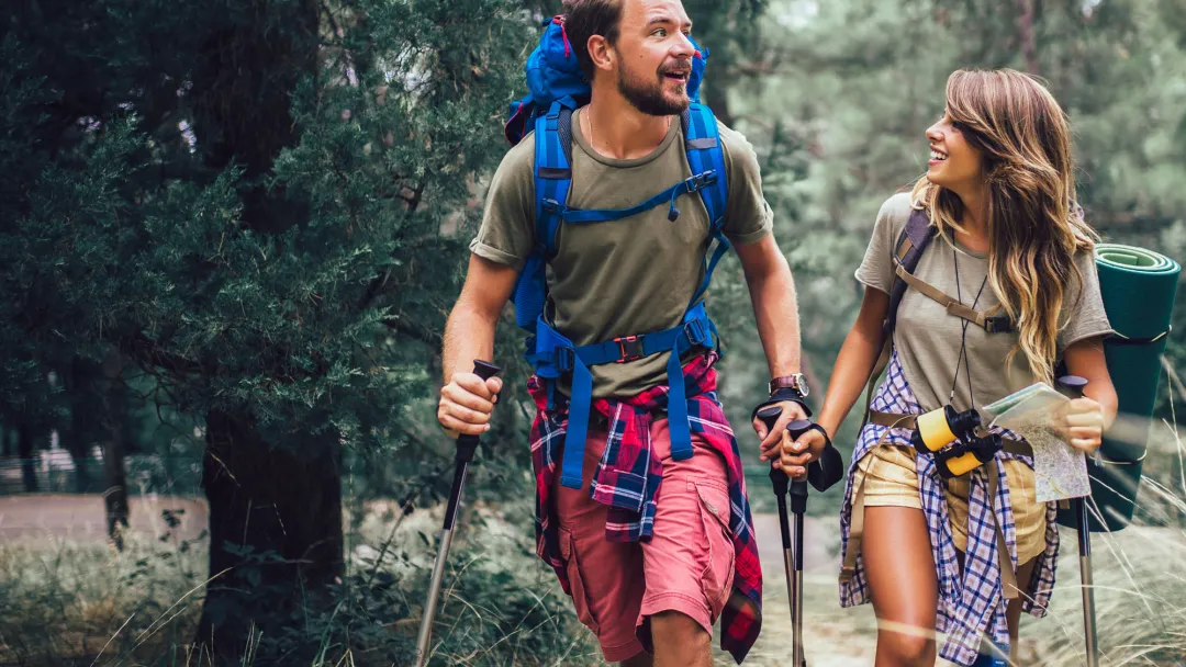 Young couple hiking in woods