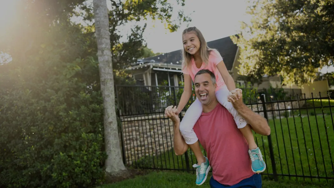 a man with a child on his shoulders