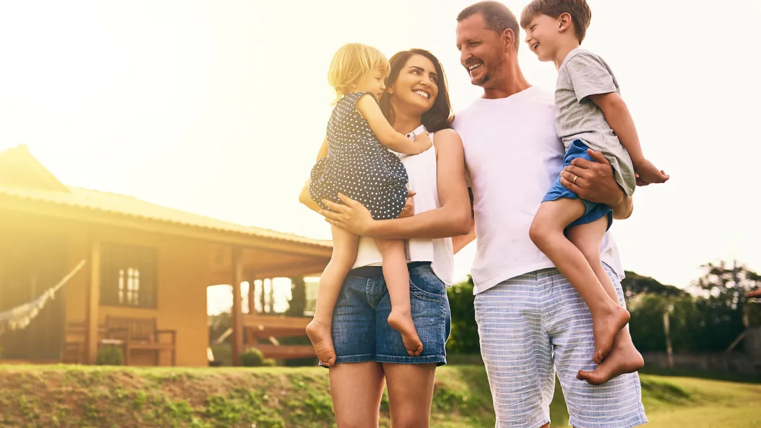 Family walking together outside at sunset
