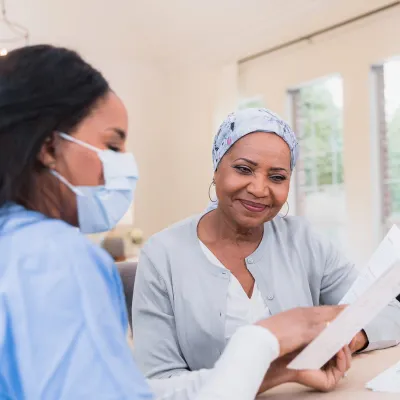 A Health Provider Covers Some Text with a Patient