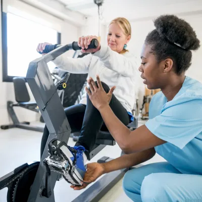 A Therapist Helps a Patient Through a Physical Therapy Session.