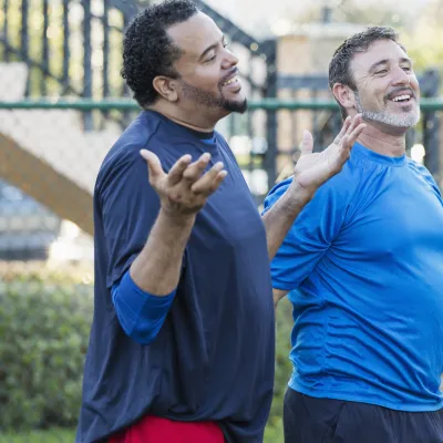 Group of men staying healthy playing basketball