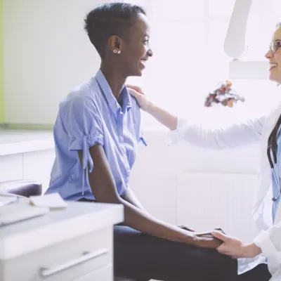 A woman at her annual check up with her trusted doctor