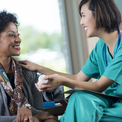 A nurse answers a woman's health questions.
