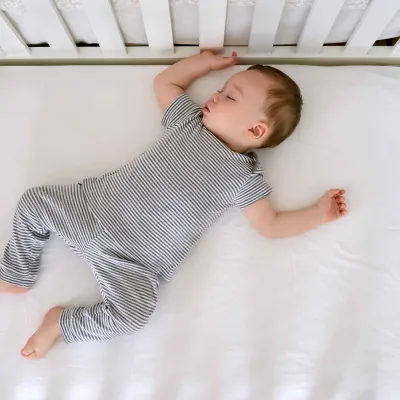 Cute Baby Sleeping In Bed