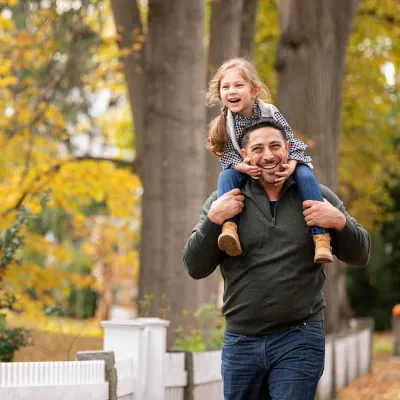 Father and Daughter walking outdoors
