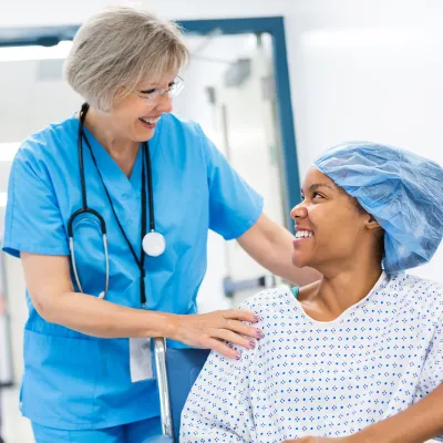 Nurse with young female patient at the hospital.