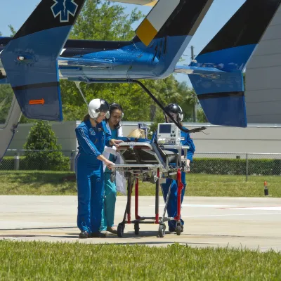 Helicopter crew with a patient.