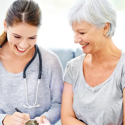 A woman goes over her lab results with her doctor.