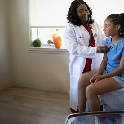 a-girl-beign-checked-by-a-doctor