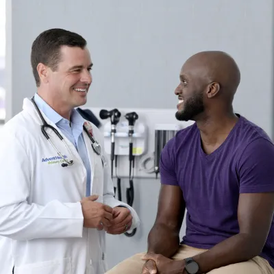 A Primary Care+ Physician Speaks with His Patient