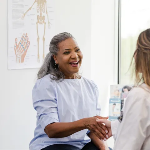 A Patient Greets a Provider in an Exam Room