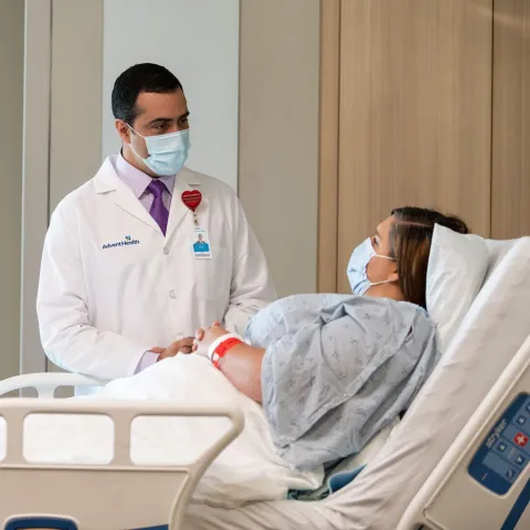A Doctor Speaks to a Patient From Her Hospital Room.