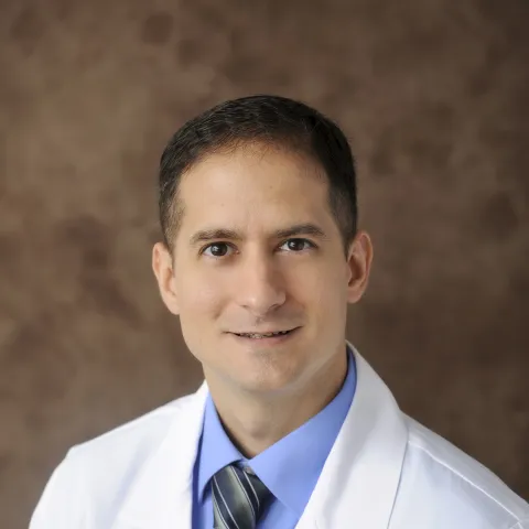 Professional headshot of Enrique Vega