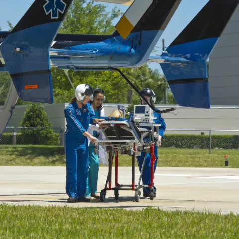 Helicopter crew with a patient.