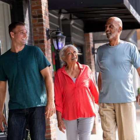 Hispanic family walking outside shops