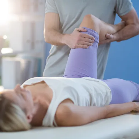 Physical Therapist Performing Stretch
