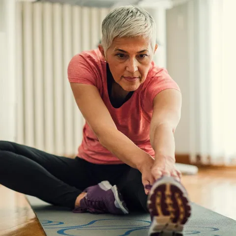 Senior woman stretching
