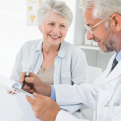 A senior talks with her doctor.