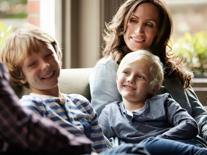A family spends time together on the couch.