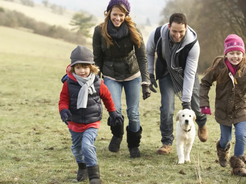 A family goes on a hike together.