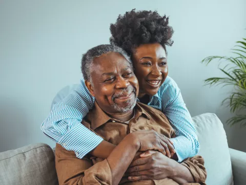 A Daughter Hugs Her Senior Father