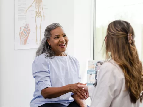 A Patient Greets a Provider in an Exam Room