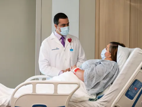 A Doctor Speaks to a Patient From Her Hospital Room.