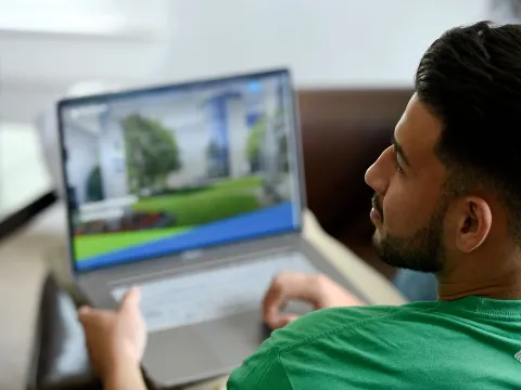 A man using a laptop.