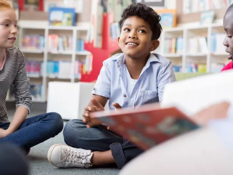 A child enjoying a story in the classroom.