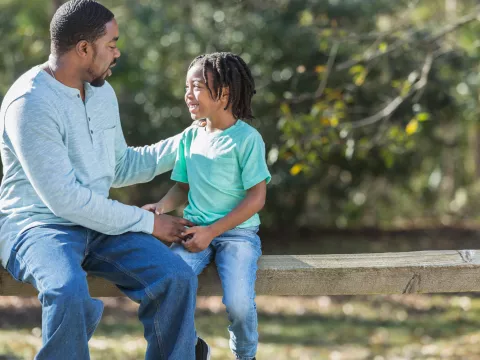 A father has a heart to heart conversation with his son.