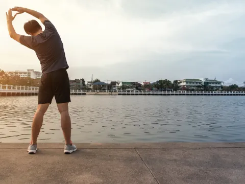 A man stretching before a run. 