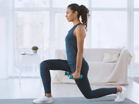 A woman exercising at home.