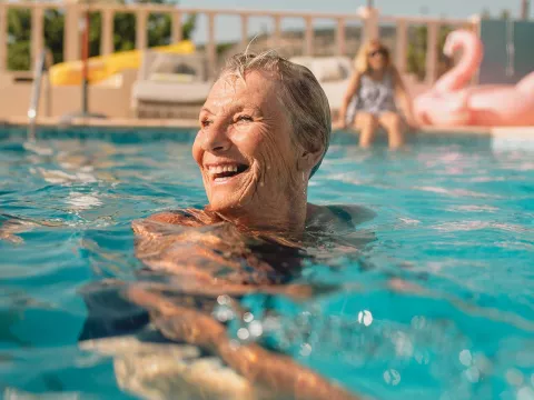 Mature woman swimming in pool